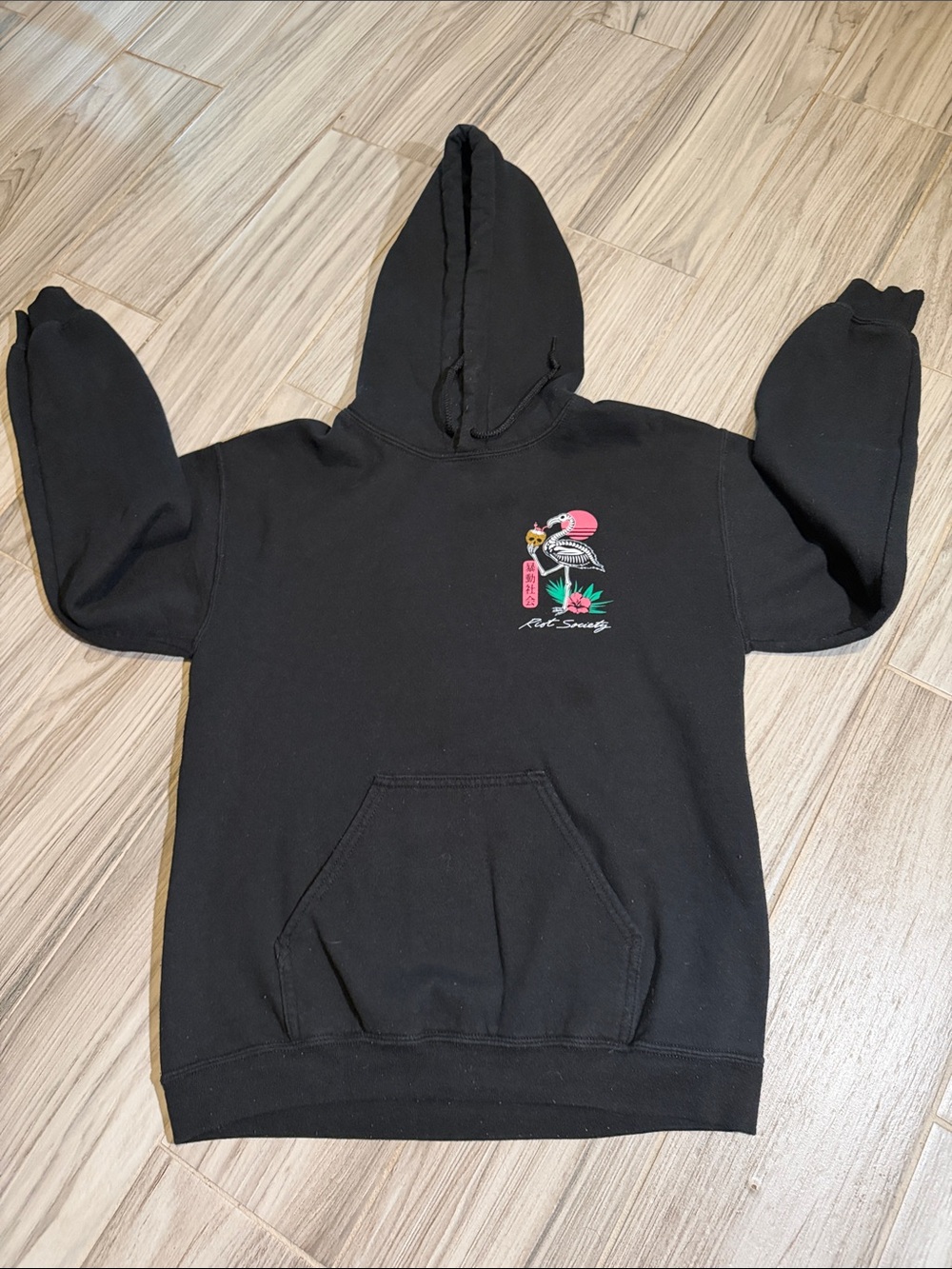 riot society black hoodie with pink and green flamingo graphic